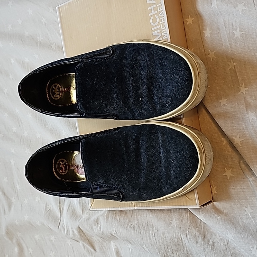 Slip on navy suede sneakers.